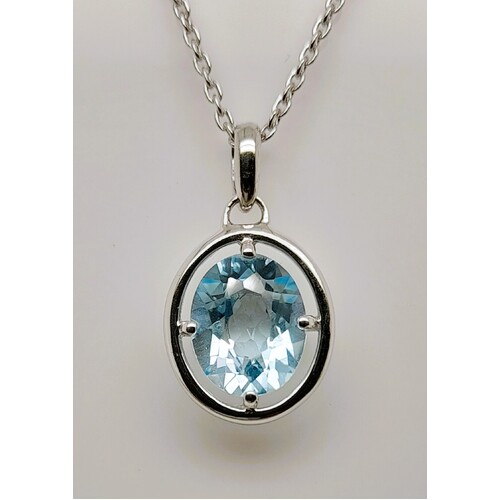 Sterling Silver Claw Set Blue Topaz Pendant