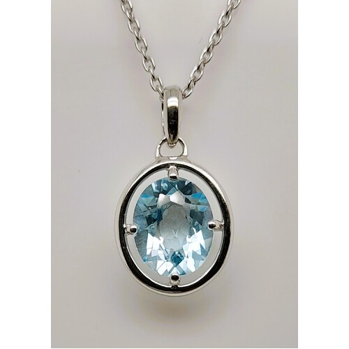 Sterling Silver Claw Set Blue Topaz Pendant